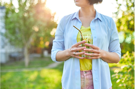 Woman drinking summer citrus, a Food & Drink Photo by IlliaBondarPhotography