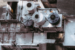 Urban rooftop with water tanks, an Industrial Photo by SkyNext