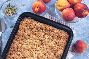 Delicious Peach Crisp or cobbler with brown sugar and oat streusel, horizontal,, a Food & Drink Photo by iuliia_n