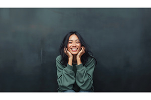 A smiling Asian woman in a casual, a Person Photo by Sergey Kotenev