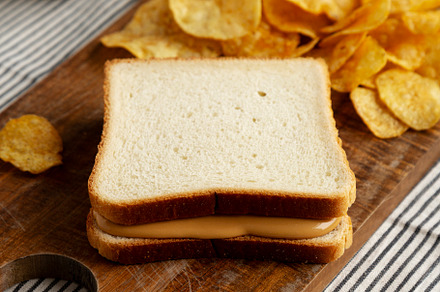 Homemade American Peanut Butter Sandwich on a Wooden Board, side