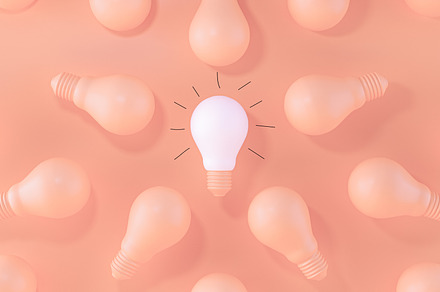 Light Bulb white between the others, a Business Photo by Zama Studio