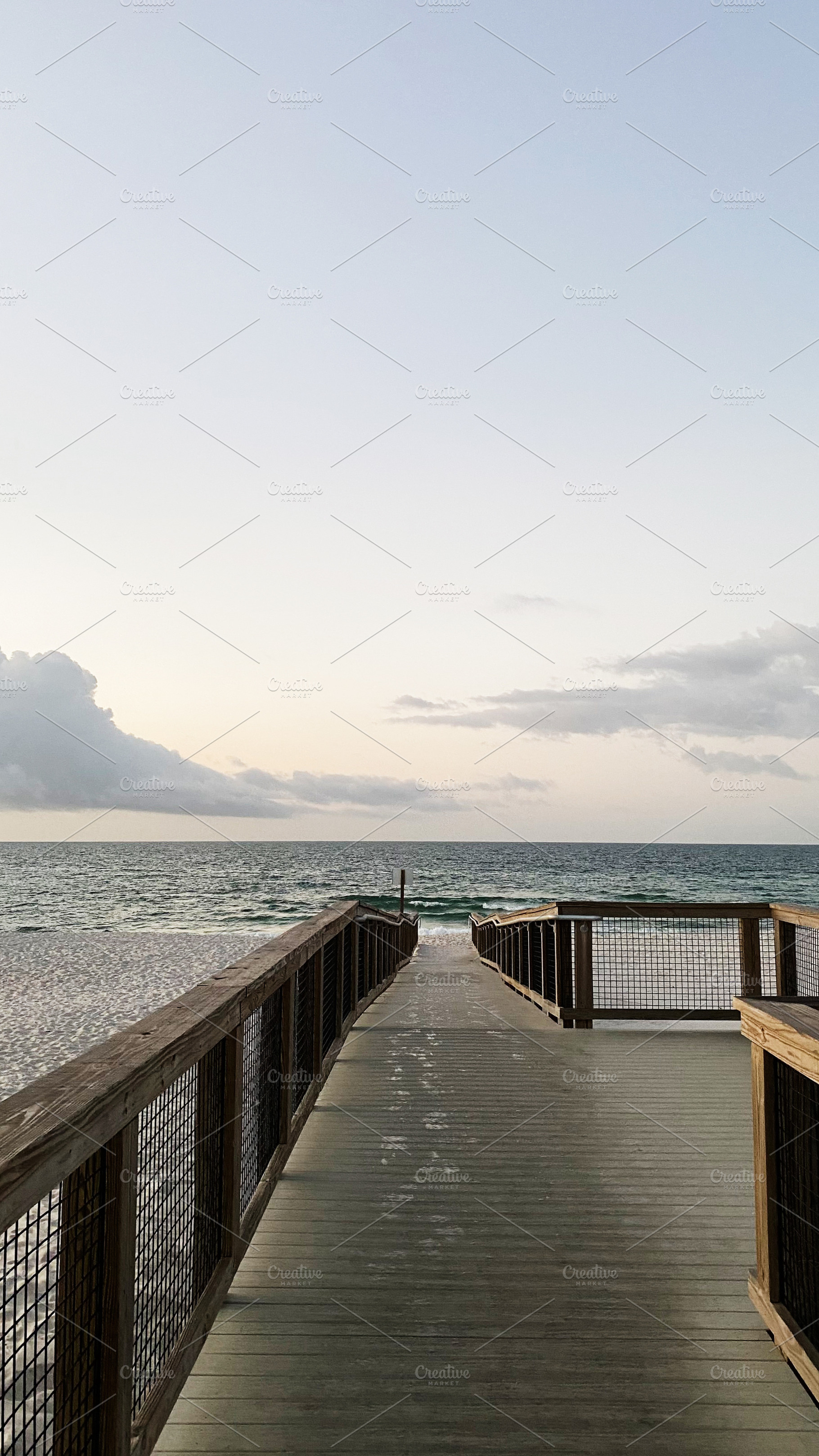 Serene Pensacola beach boardwalk leads to ocean at sunset in Florida USA, a Nature Photo by AS photostudio