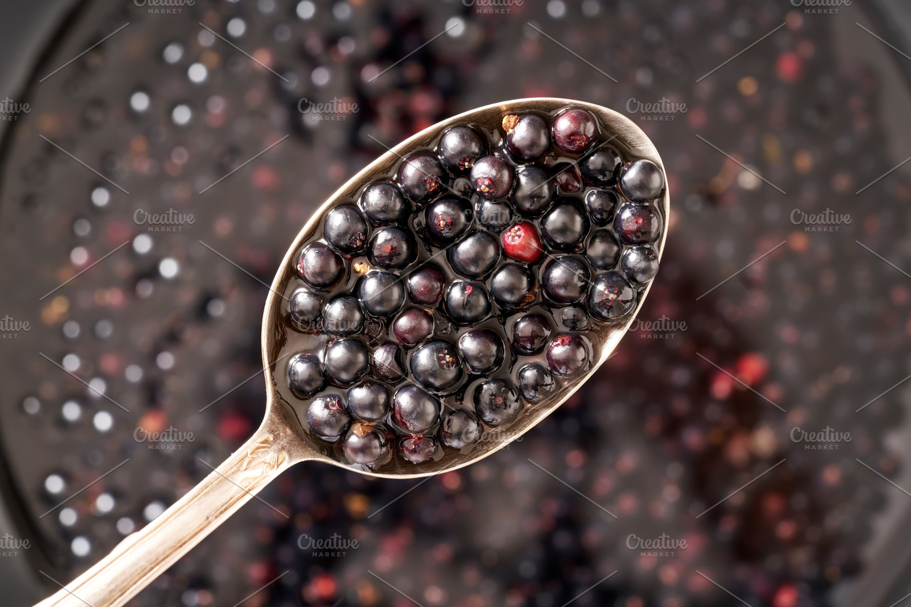 Fresh elder berries on a spoon - preparation of homemade herbal, a Food & Drink Photo by Madeleine Steinbach
