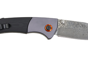 Folding knife with patterned Damascus steel blade and combinatio, an Industrial Photo by ndanko