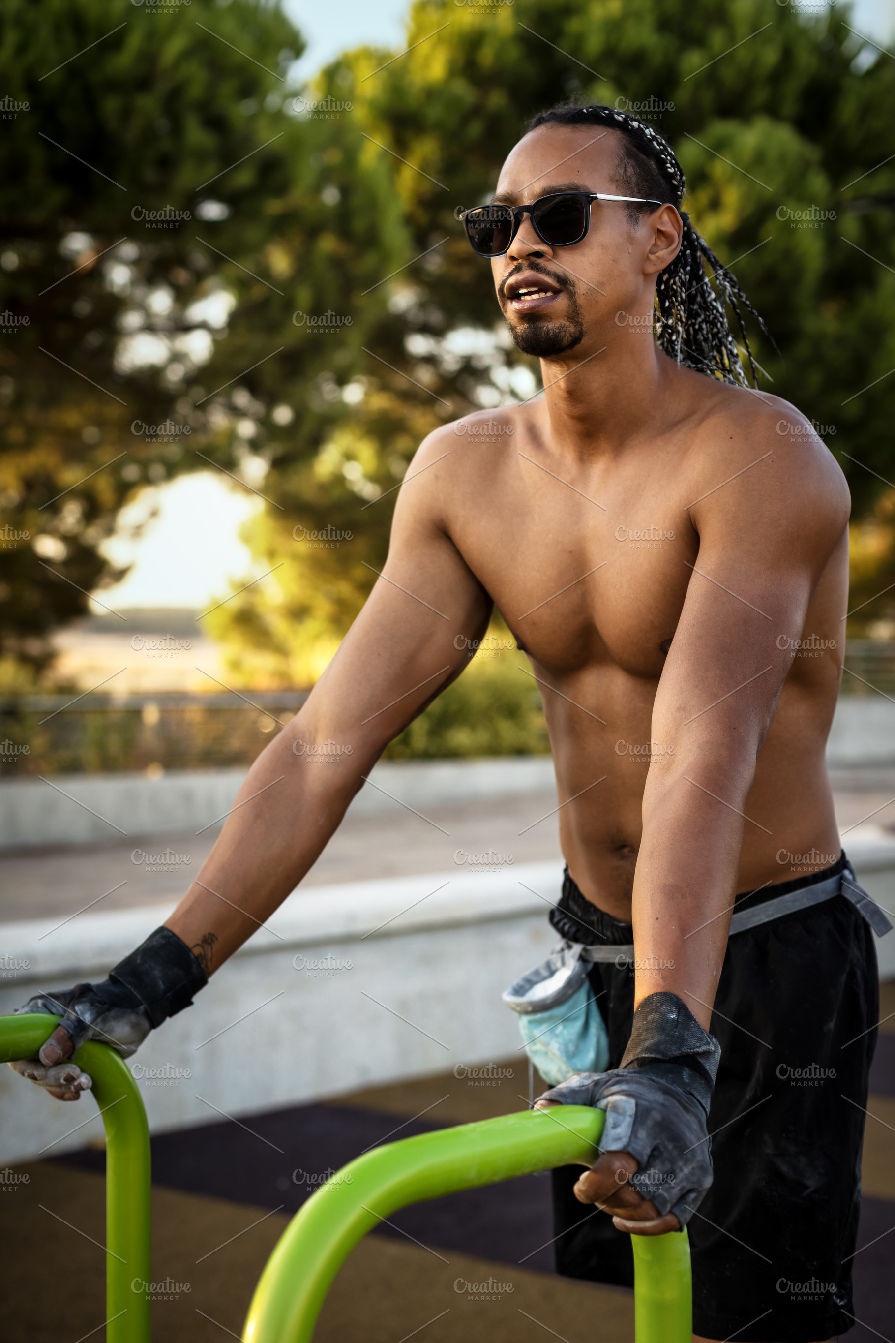 Young man training outdoors in a par, a Person Photo by Perpis