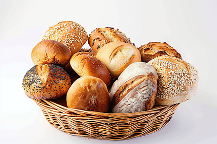 Freshly different baked bread in basket isolated on white background, a Food & Drink Photo by AlyaAnd