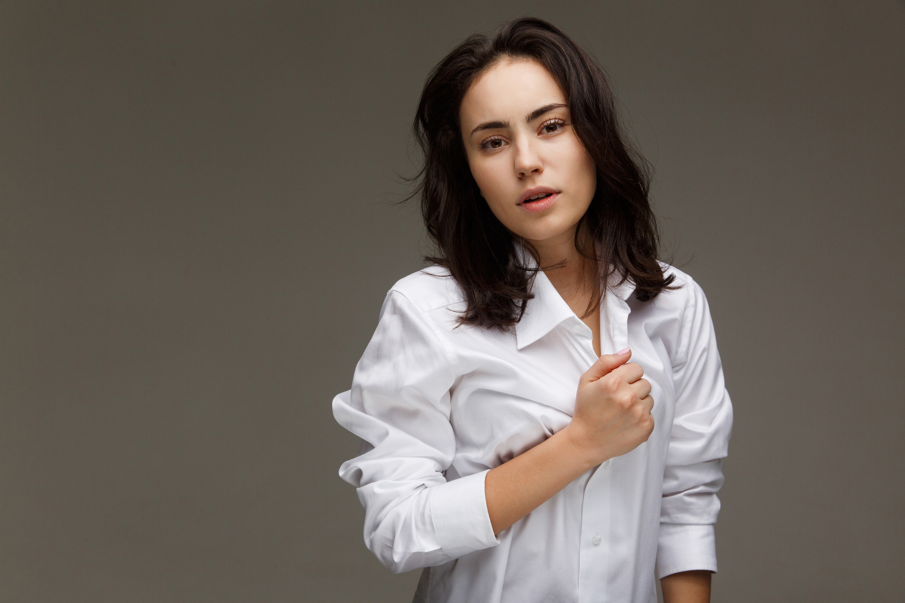 Beautiful girl in a white shirt on a light background featuring white ...