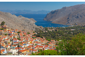 Symi village and bay panorama with, an Architecture Photo by kavalenkava
