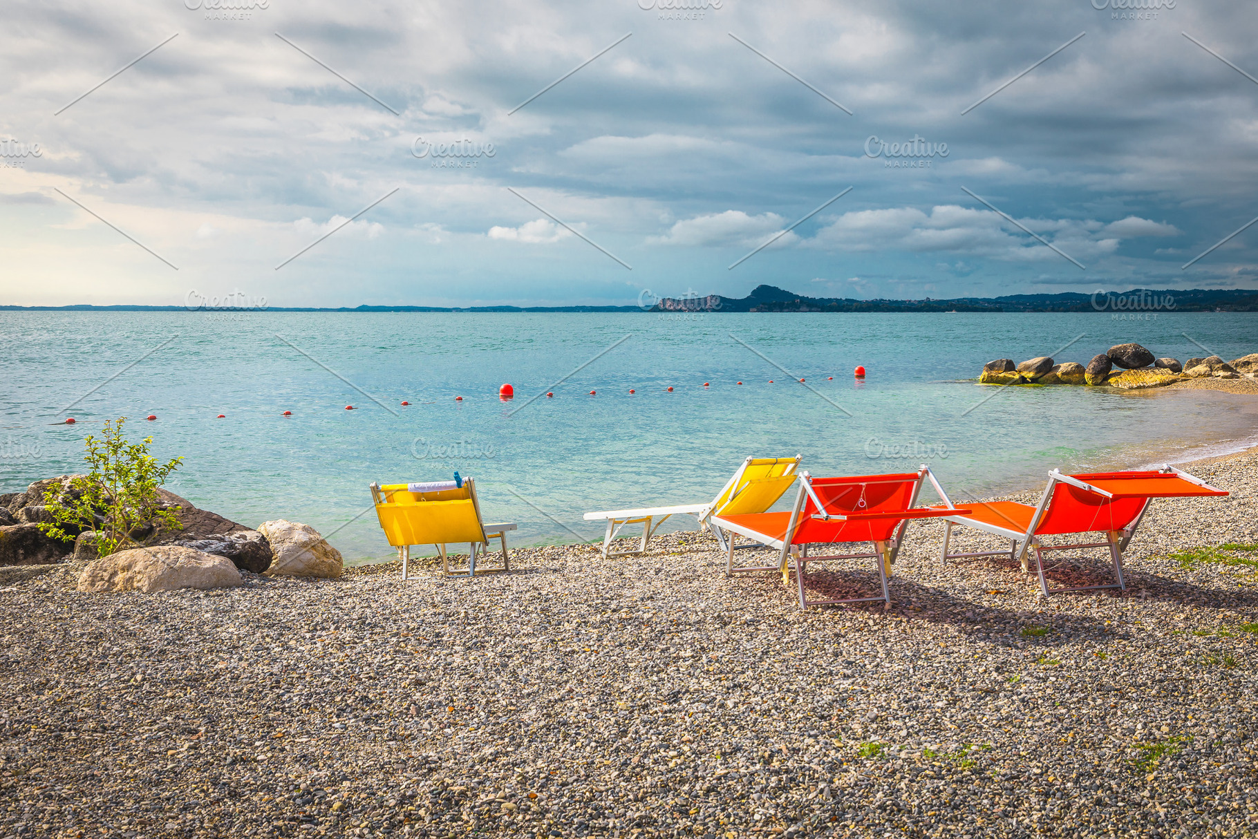 Amazing beach with colorful sunbeds, a Sports & Recreation Photo by Alpine Dreams
