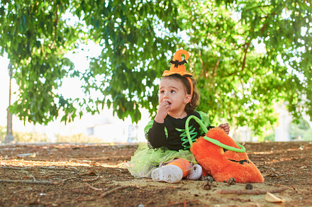 Baby in halloween costume outdoors