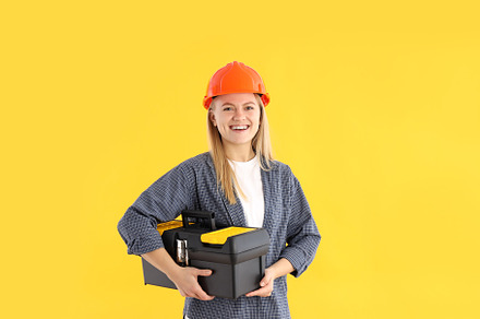 Concept of professions, young woman on yellow background, a Person Photo by AtlasStudio