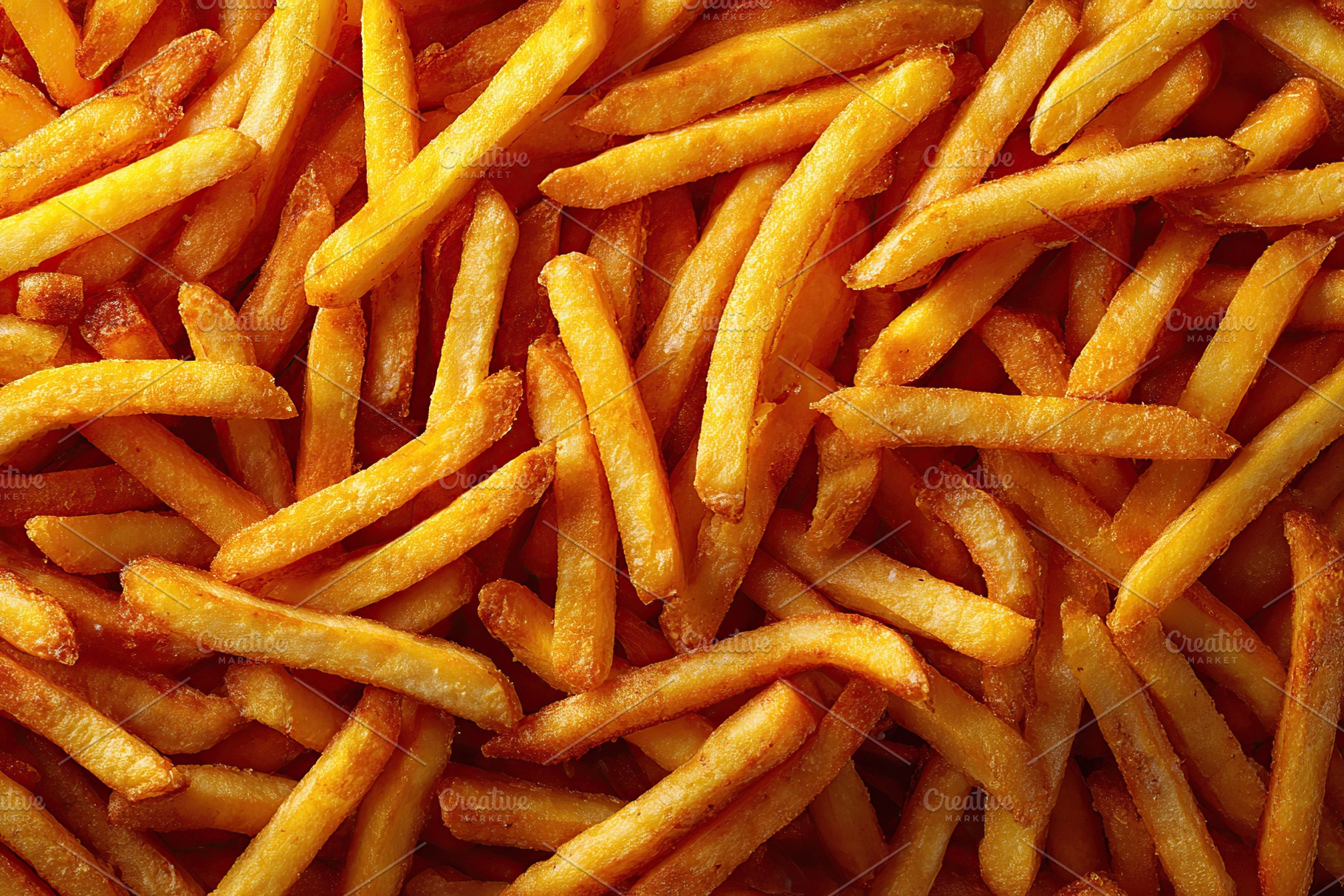 Crispy golden french fries served hot and fresh at a bustling street food stall, a Food & Drink Photo by AlyaAnd