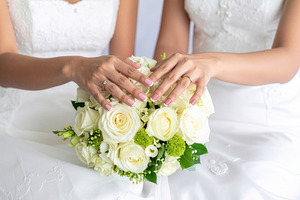 Brides Showing Wedding Rings Over White Bouquet, a Person Photo by Davizro's Market