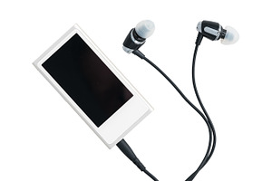 Small mp3 music player and earbuds featuring music, player, and mp3, a Technology Photo by Backyard Stock