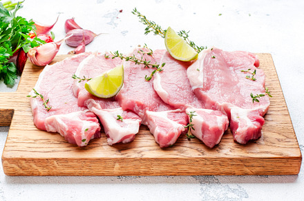 Raw pork chops, loin  on wooden cutting board prepared for cooki, a Food & Drink Photo by 5PH