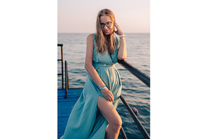 Woman in Flowing Dress on Seaside, a Person Photo by Jan Jack Russo Media