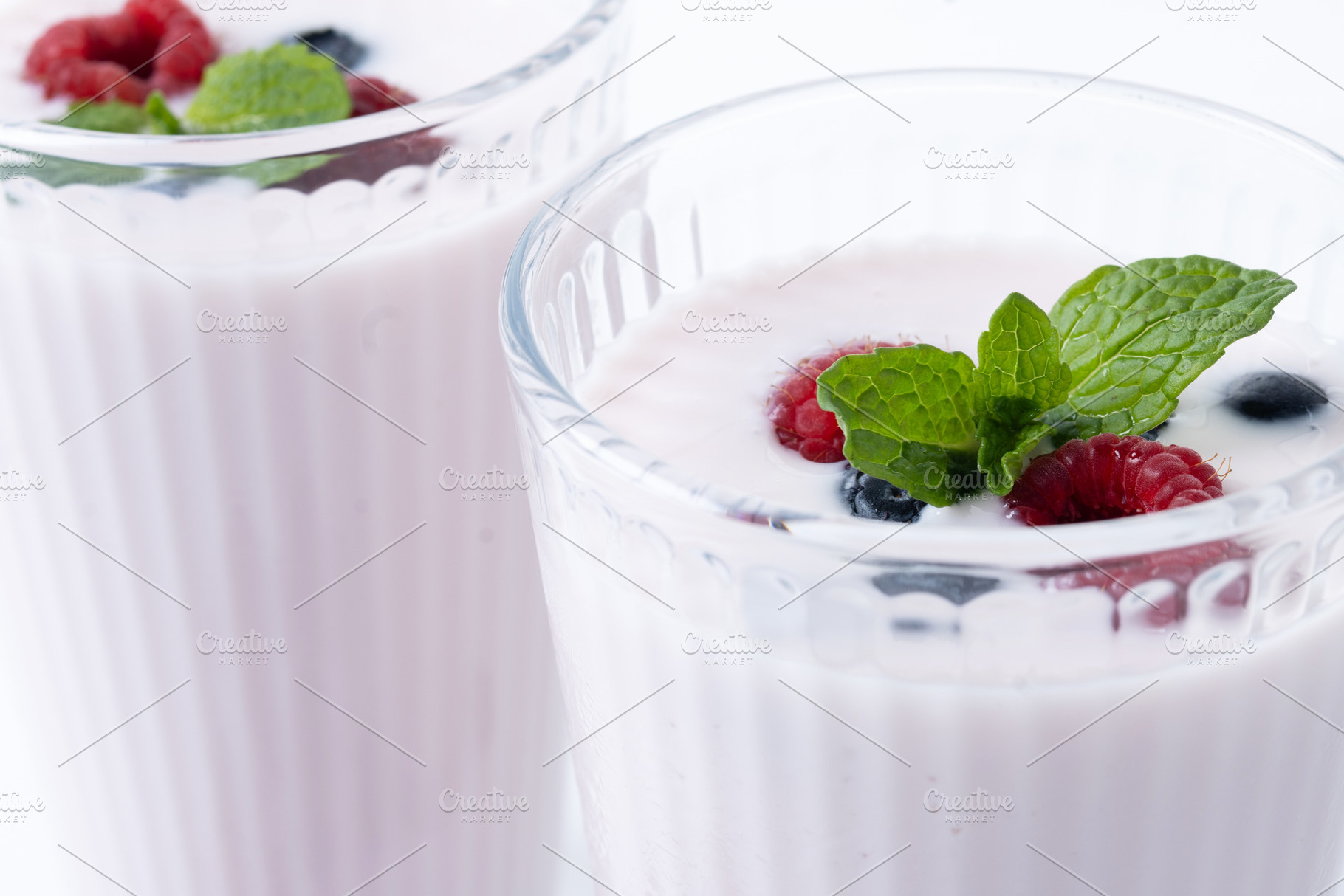 Fresh raspberry and blueberry smoothie isolated on white backgro, a Food & Drink Photo by etorres69