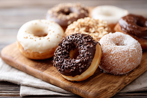 Glazed donuts with chocolate, sugar, a Food & Drink Photo by MistyDay