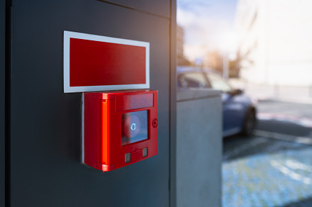 Red fire alarm outdoor mockup scene, a Technology Photo by SkyNext