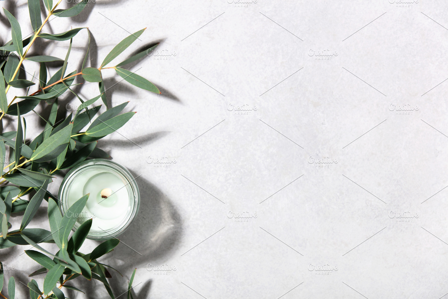 Eucalyptus Leaves and Scented Candle on Minimal Light Background, an Abstract Photo by Natalia Klenova's Shop