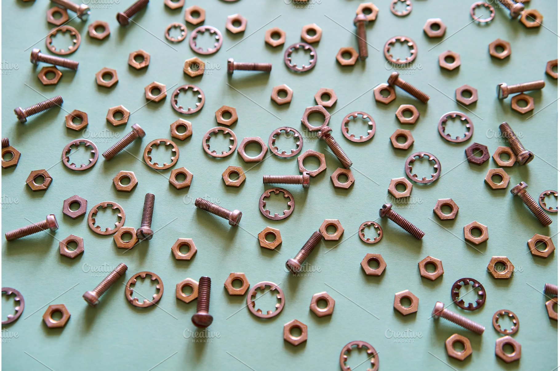 Scattered metal nuts bolts and, an Industrial Photo by Gladkov photography