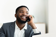 Glad african businessman talking on | Stock Photos ~ Creative Market