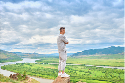 A man in light-colored clothes, a Person Photo by PhotoXab