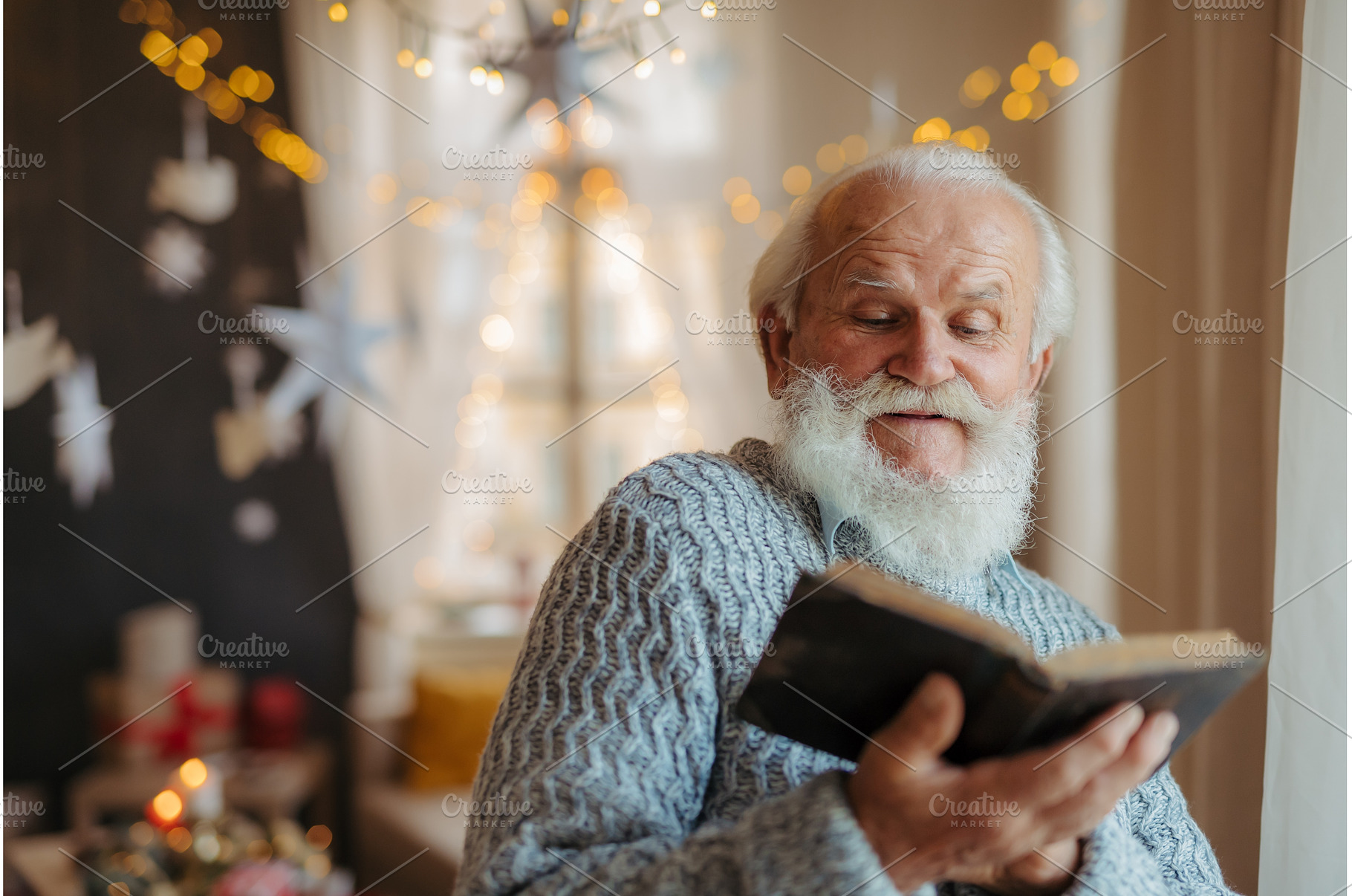 Old man reading from bible during, a Person Photo by HalfPoint