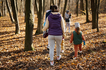 Mother with kids in family leisure at autumn activity in forest., a Person Photo by AS photostudio
