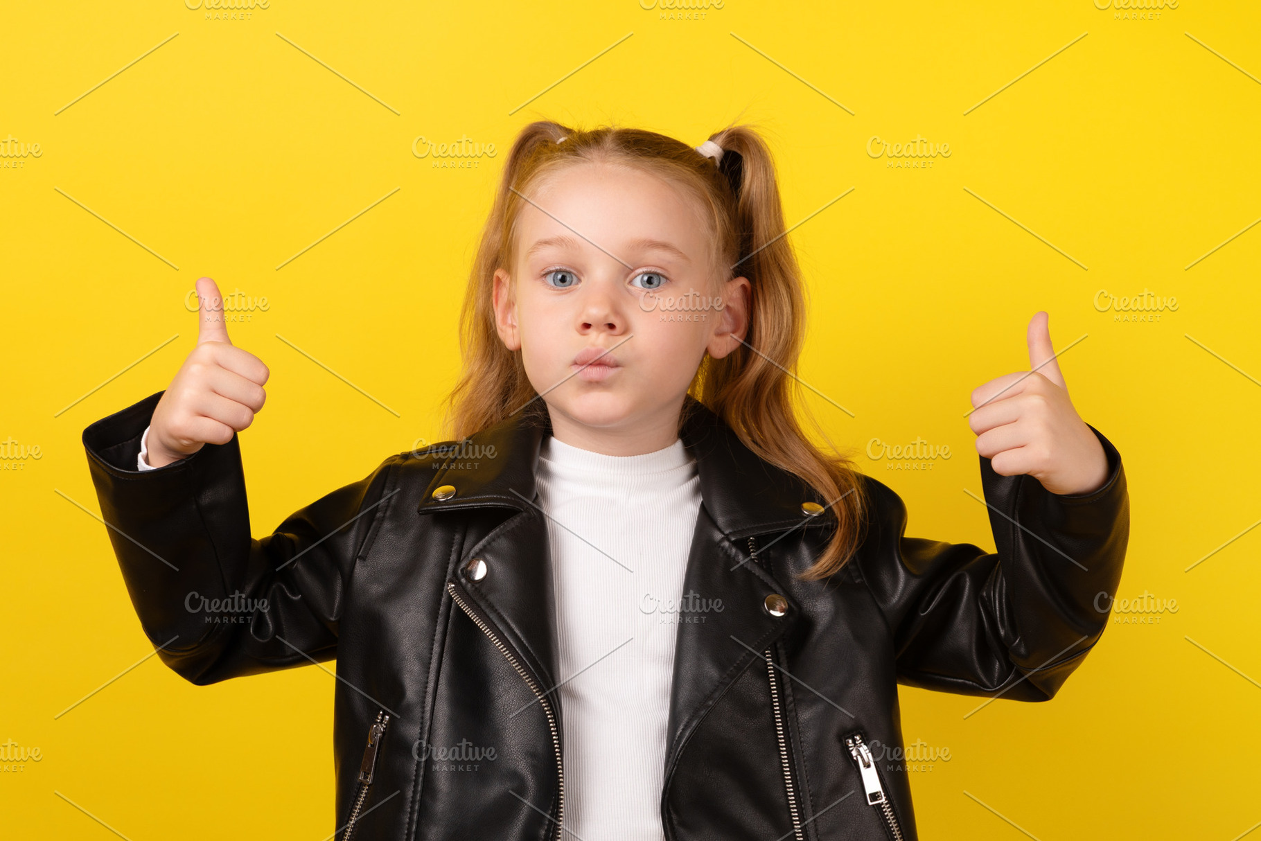 Young girl in a black leather jacket making a surprised face and, a Person Photo by Ales Munt