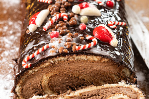 Christmas chocolate yule log cake with festive decorations, a Food & Drink Photo by etorres69