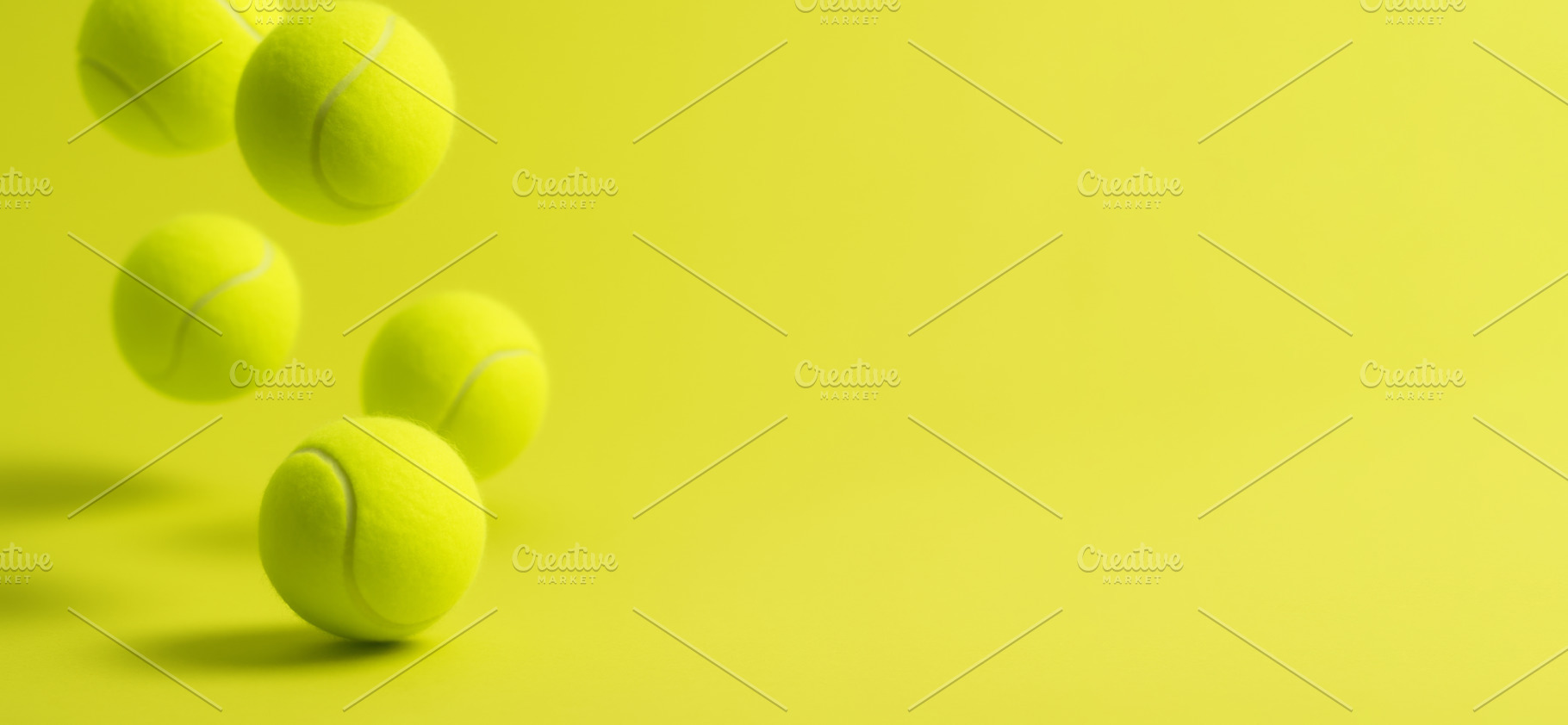Tennis balls on chartreuse background creating dynamic sporty vi, a Photo by Dvoevnore photos