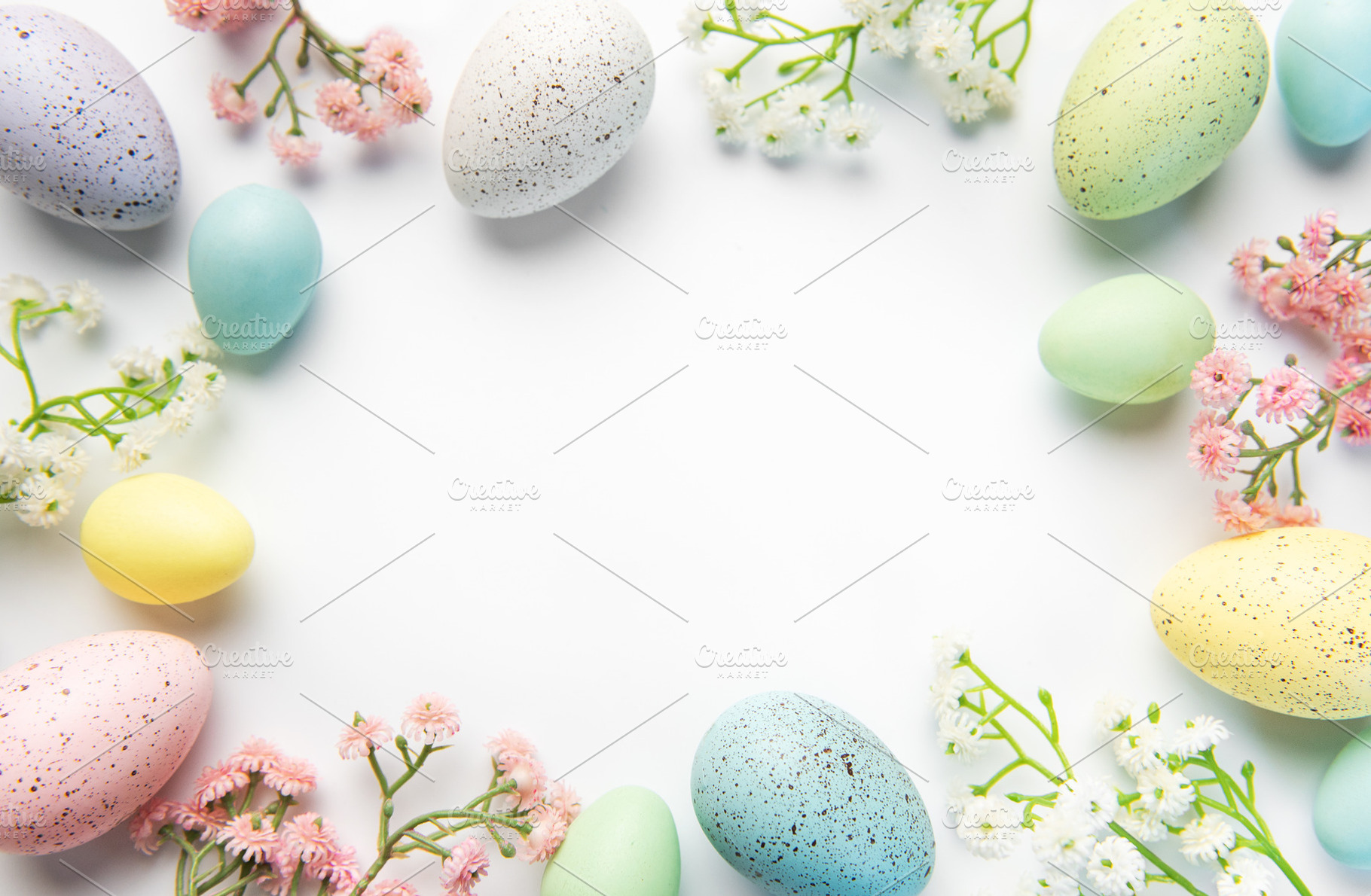 Pastel easter eggs and spring flowers creating border, a Holiday Photo by Olena Rudo
