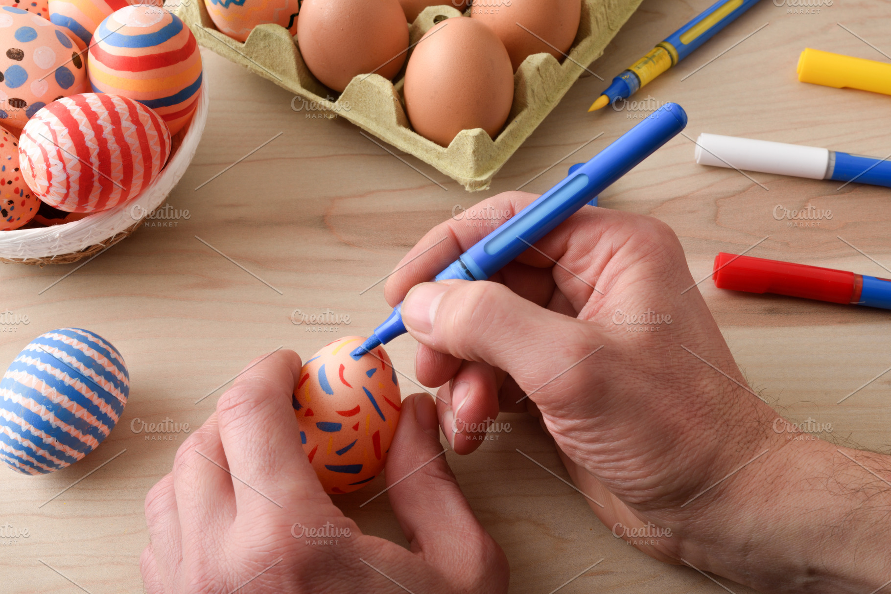 Hand Decorating Easter Egg with Colorful Marker, a Holiday Photo by Davizro's Market