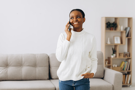 African woman talking by phone, a Person Photo by Cherkas Photography