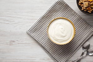 Organic Whole Fat Greek Yogurt in a Bowl, top view. Copy space., a Food & Drink Photo by LiudmylaChuhunova