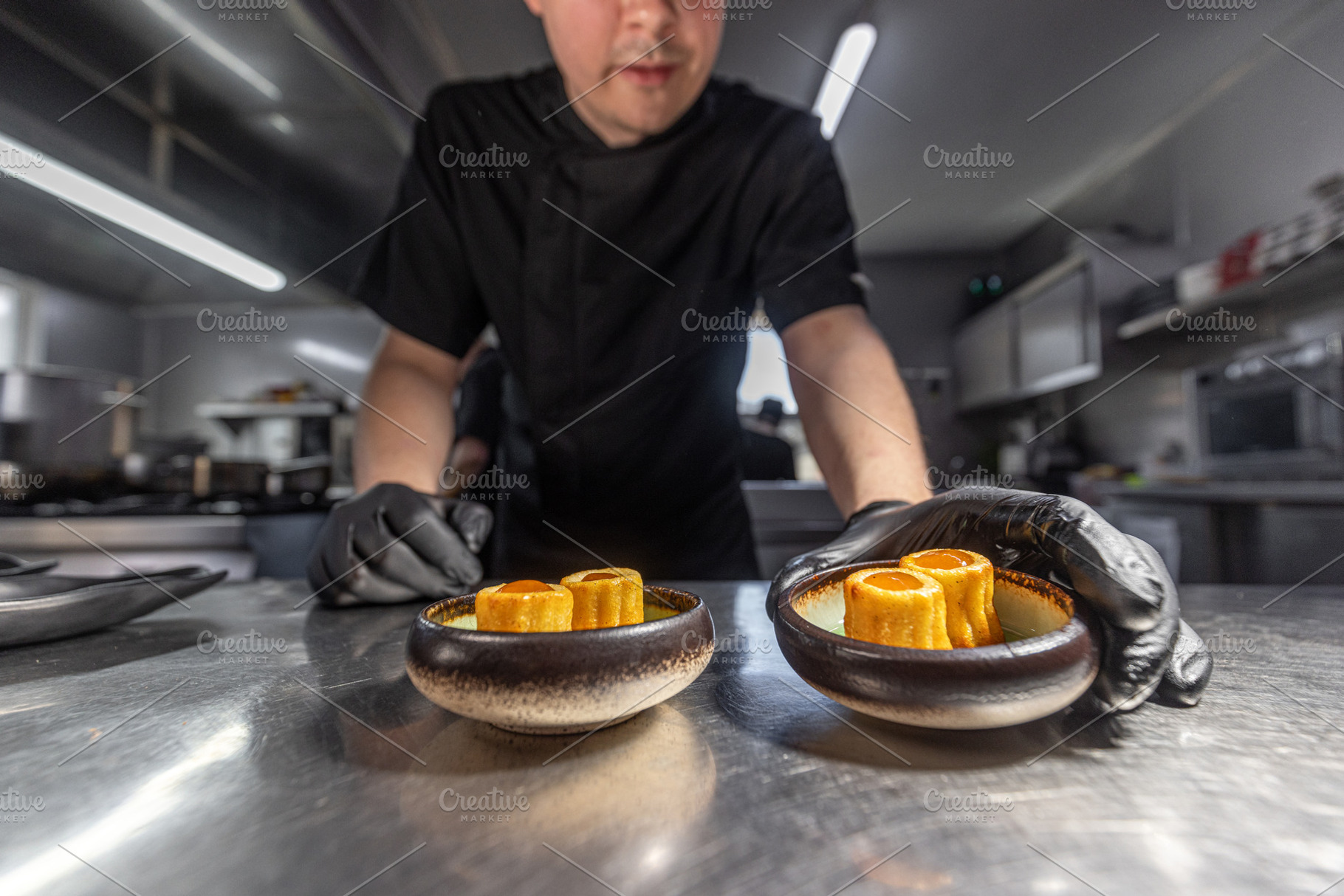 Chef finishing gourmet appetizers, a Photo by Grafvision photography