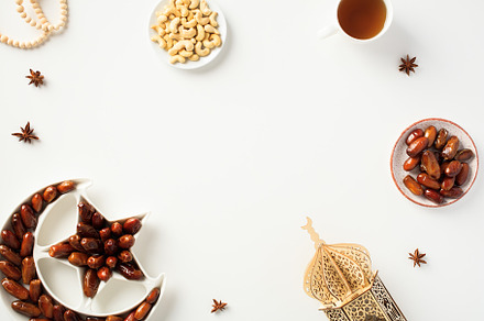 Ramadan Kareem holiday table with dates fruits plate, nuts, wooden lantern mosq, a Holiday Photo by photoguns