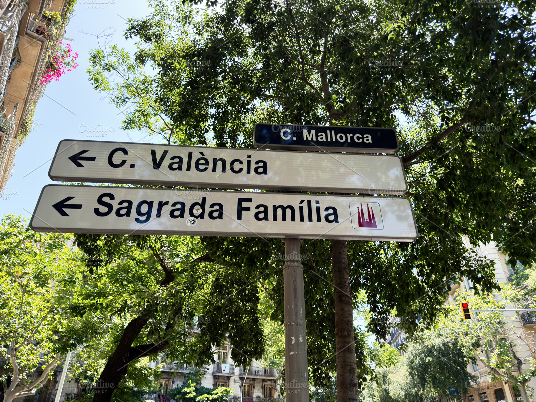 Directional street signs to Sagrada Família and Carrer Valènci, a Photo by AS photostudio