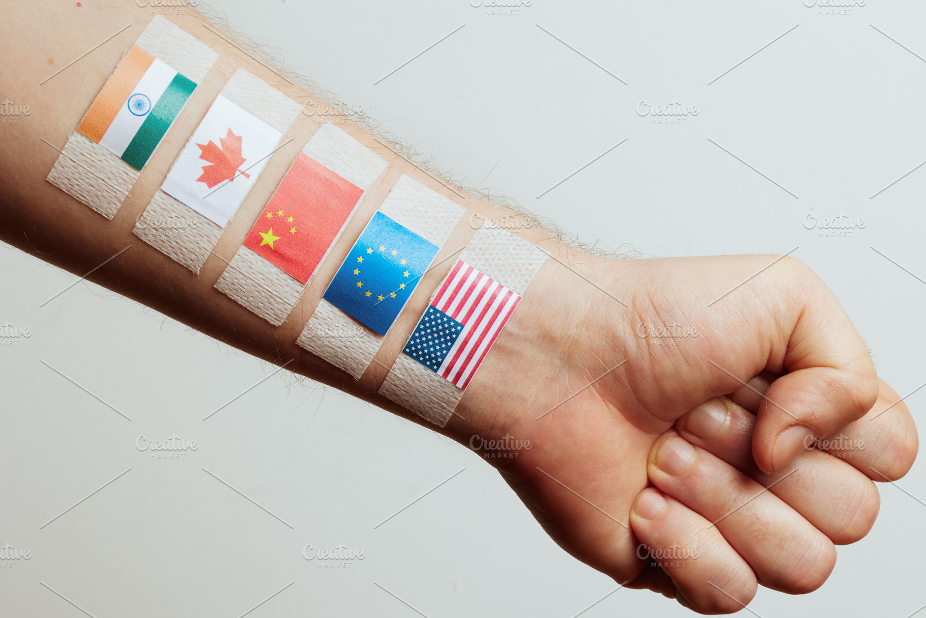 Flags of Major Economies on Arm - Global Trade Concept, a Business Photo by Alliance Images