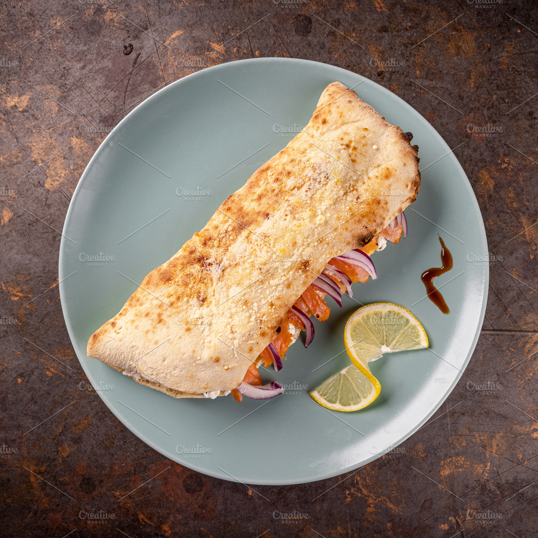 Closed calzone pizza with smoked salmon, a Photo by Grafvision photography