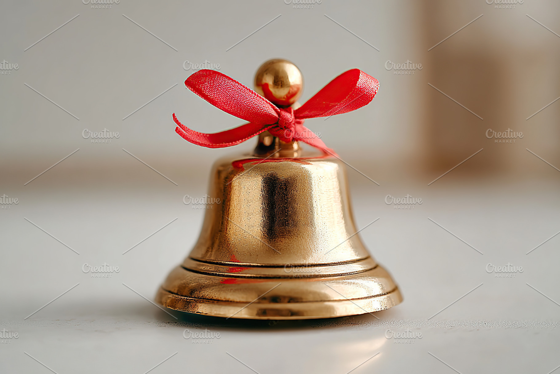 Vintage brass school bell with red ribbon symbolizing nostalgia and education, a Photo by AlyaAnd
