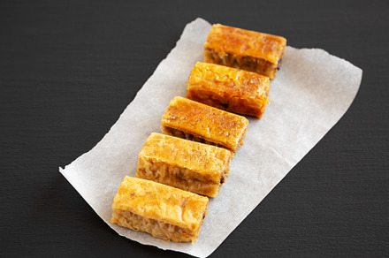 Homemade Baklavas with Honey, Chocolate and Almond on a black ba, a Food & Drink Photo by LiudmylaChuhunova