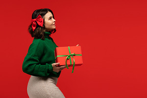 Woman with red bow in hair, a Holiday Photo by Elena Vagengeim