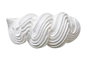 Meringue cookie cut out on a white