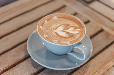 Close up  latte coffee containing aroma, art, and background