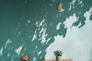 Wooden chair and table under tree sh, a Photo by Pixeness Studio