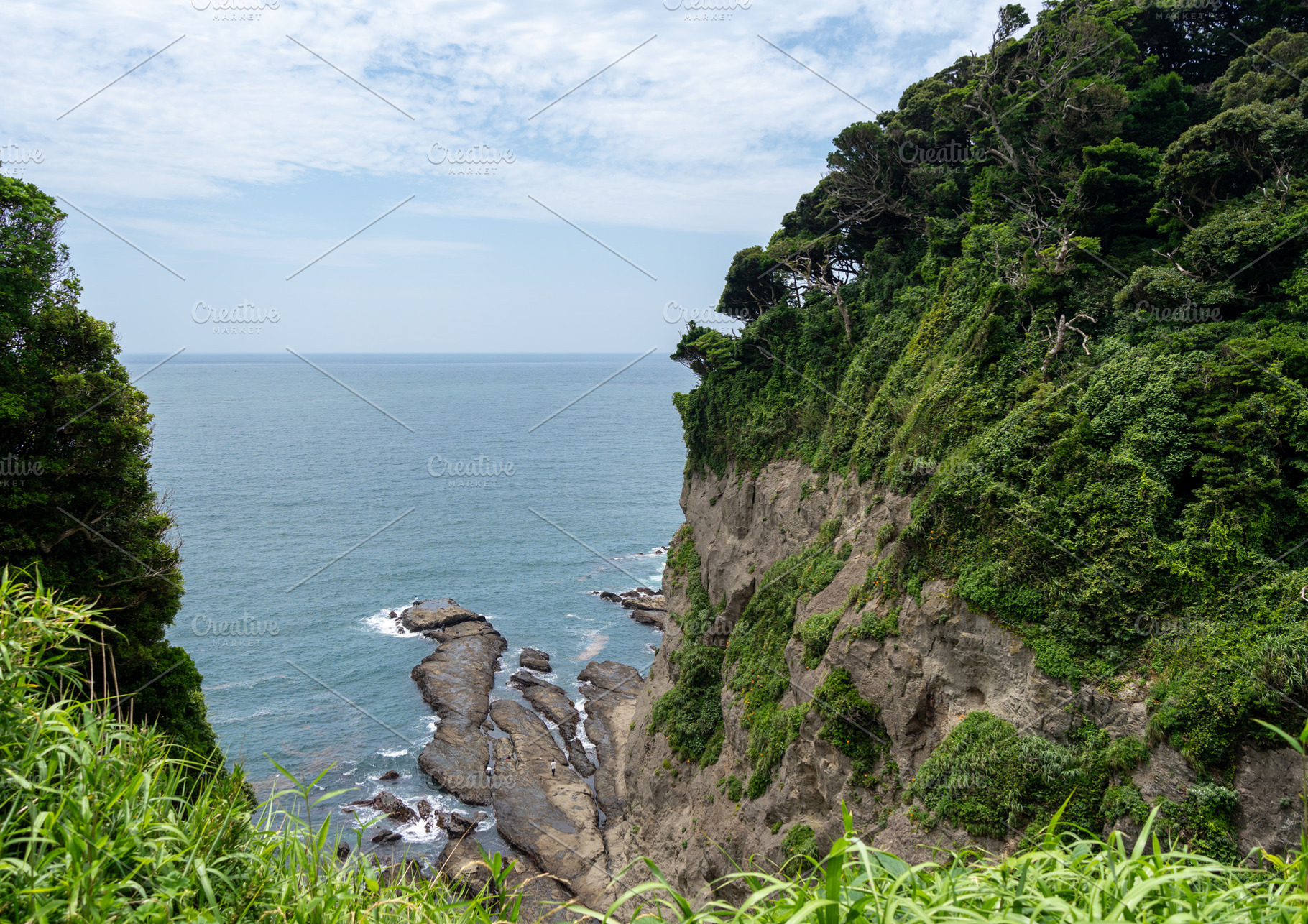 Rocky sea cliffs of Enoshima Island overlooking the Pacific Ocea, a Nature Photo by GoodGoods