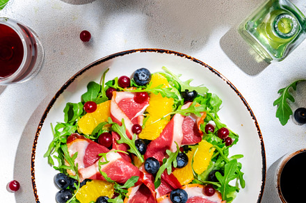 Delicious salad with smoked duck, oranges, blueberries, cranberr, a Food & Drink Photo by 5PH
